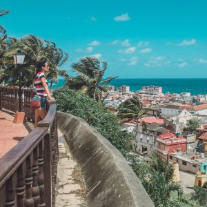 A vibrant photo capturing the colorful colonial buildings in Baracoa's historic center. - 900x900