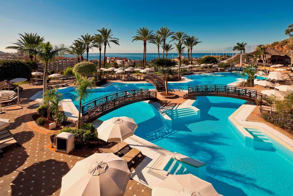 "Melia Jardines Del Teide is an adults-only, design‑led 5-star in Costa Adeje, Tenerife with sweeping Atlantic views, tiered pools, The Level lounge and an All Inclusive option in a certified sustainable hotel.
