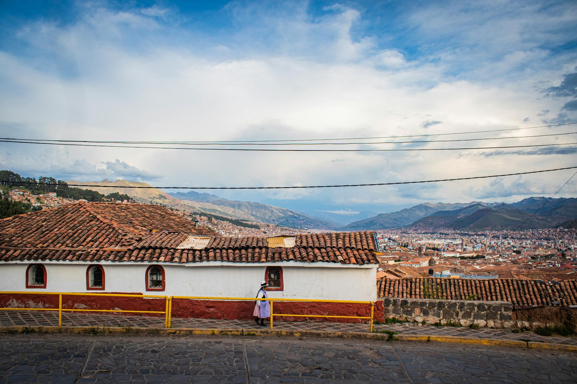 Explore Cusco's scenic cityscape with traditional rooftops and expansive mountain vie - Peru holidays by Travelisto.com